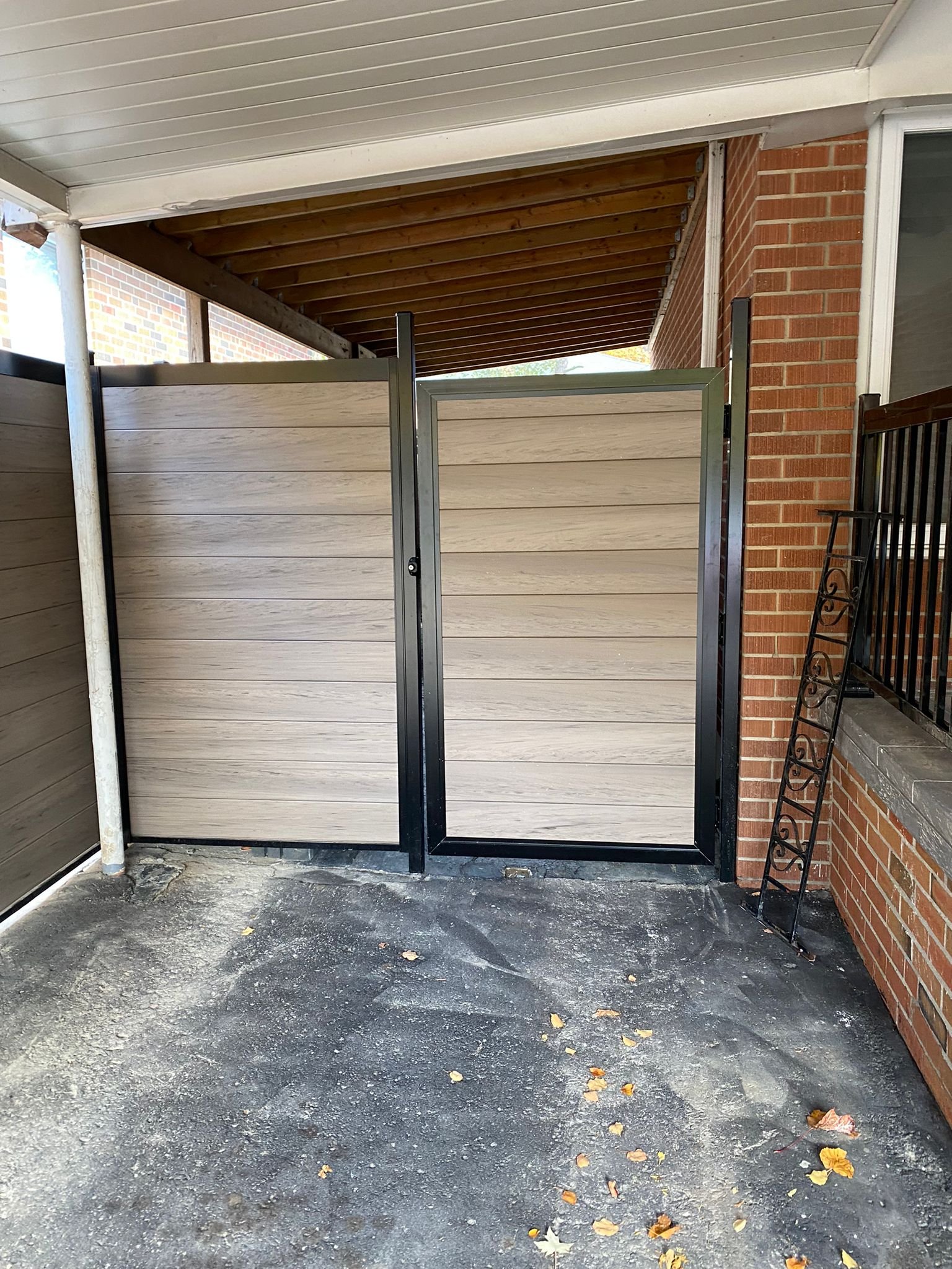 taupe vinyl fence installed to enclose yard